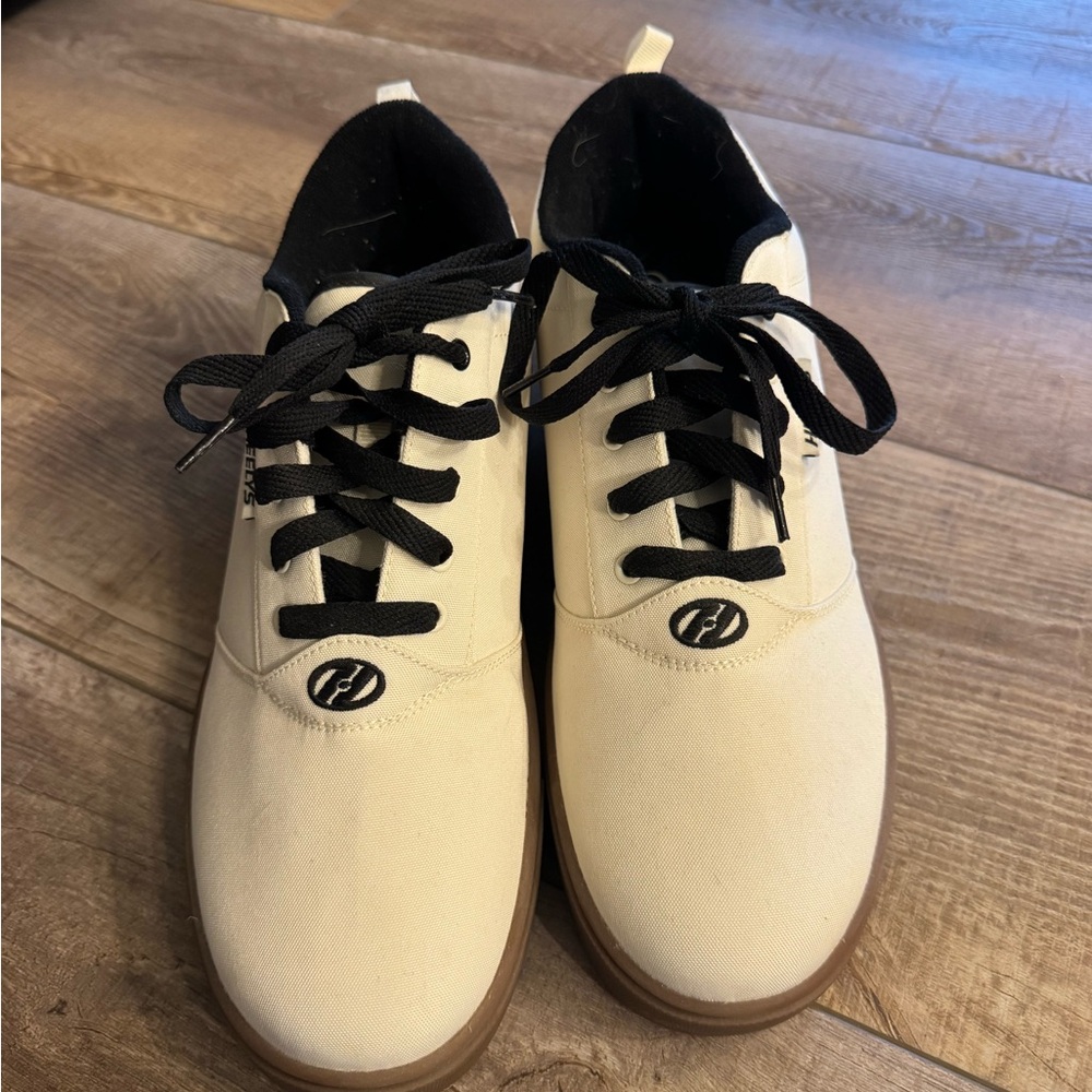 cream and black heely sneakers